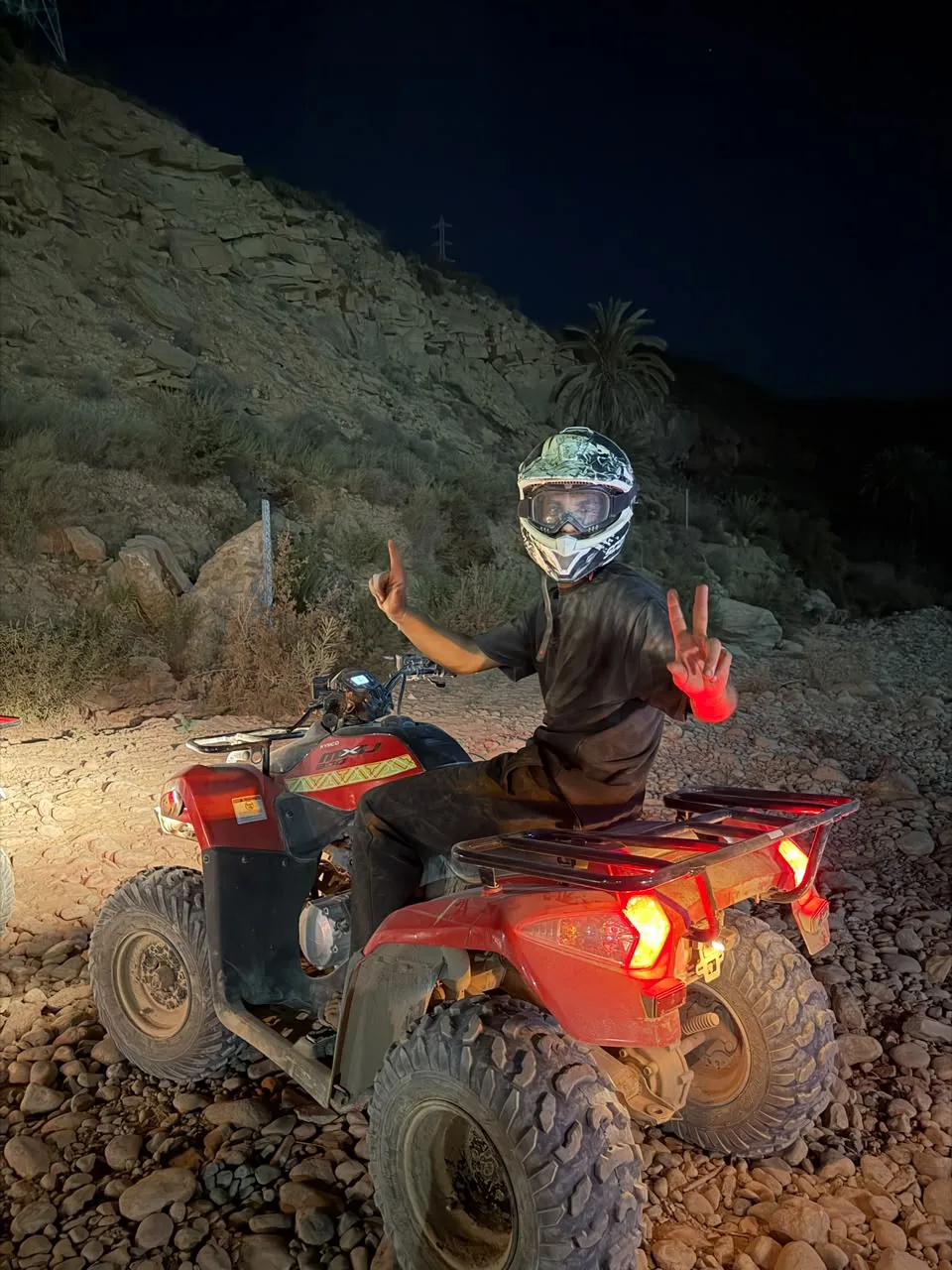 Guided quad bike group riding through an Agadir canyon